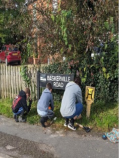 Young people planting at verges by pavements