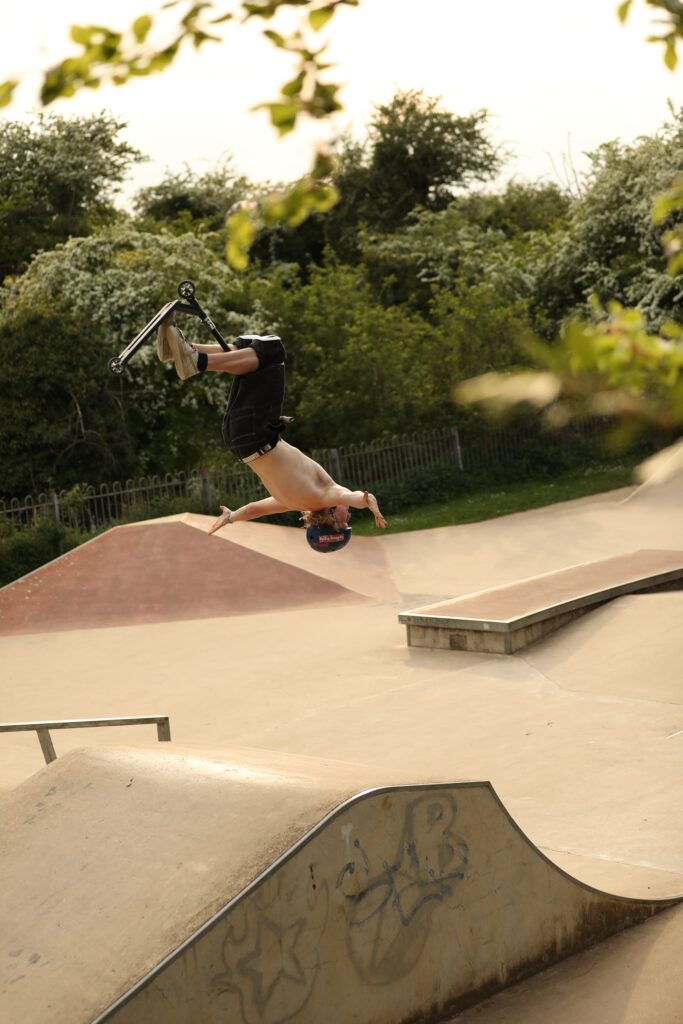 Man doing trick while on skatepark