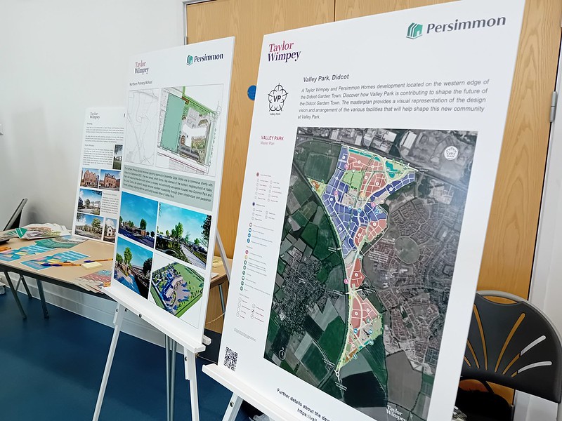 Two boards showing housing developer plans