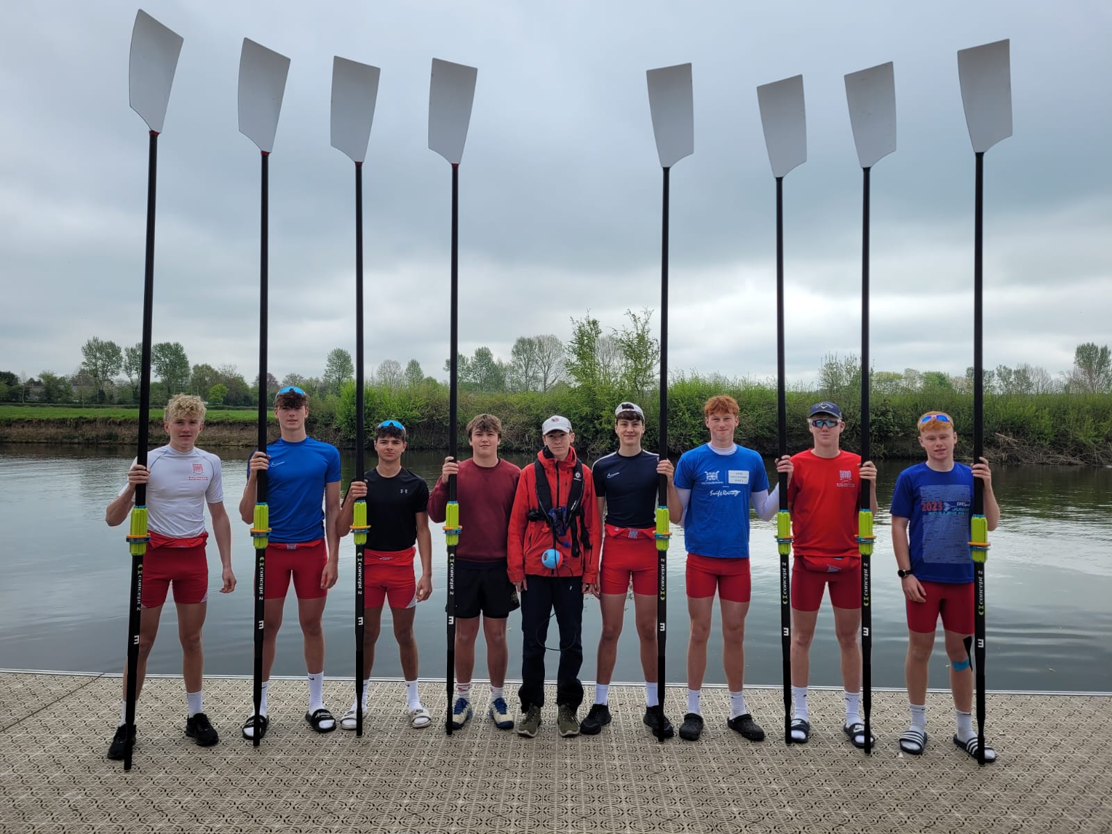 Wallingford Rowing Club with their new blades next to the River Thames