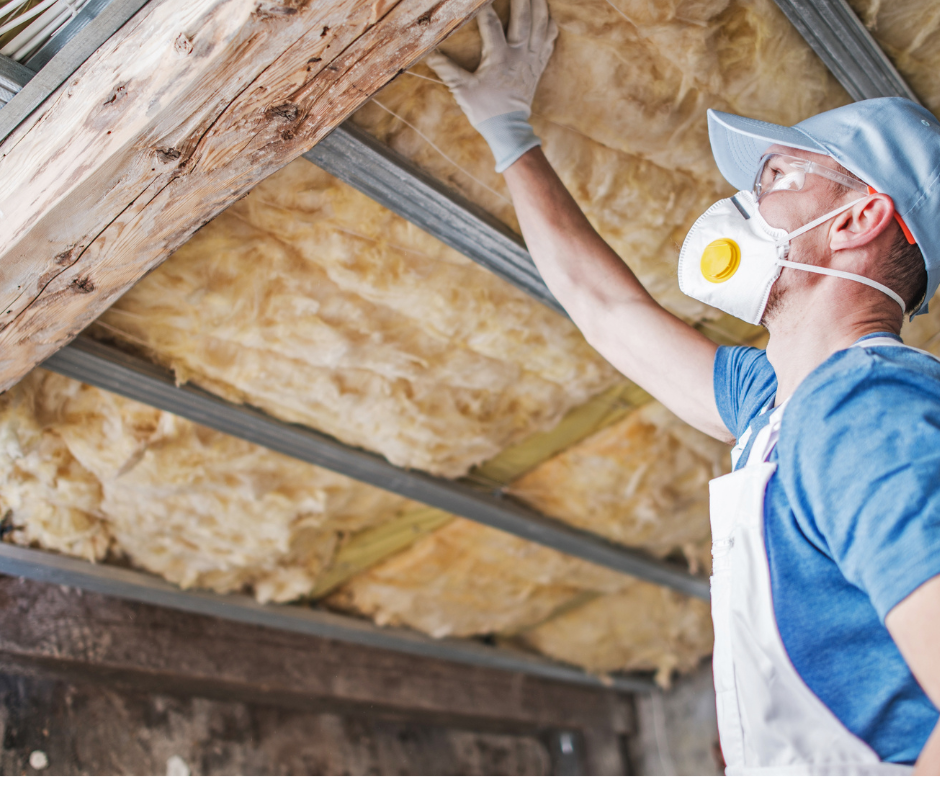 Man inspecting insulation which can keep heat out in summer and cold in the winter